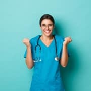 Smiling medical professional against a solid backdrop
