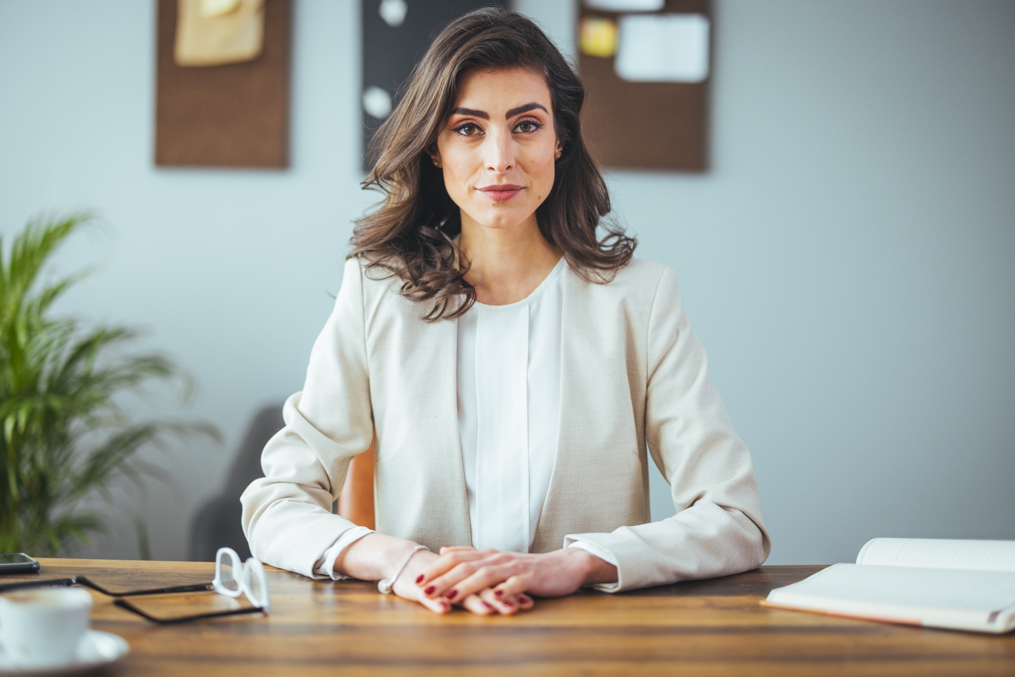 Professional woman seated at a desk for a job interview