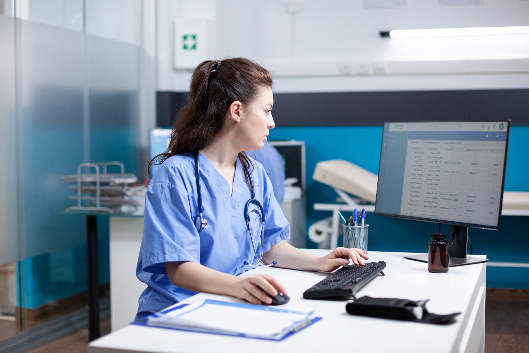 Female medical professional using a computer