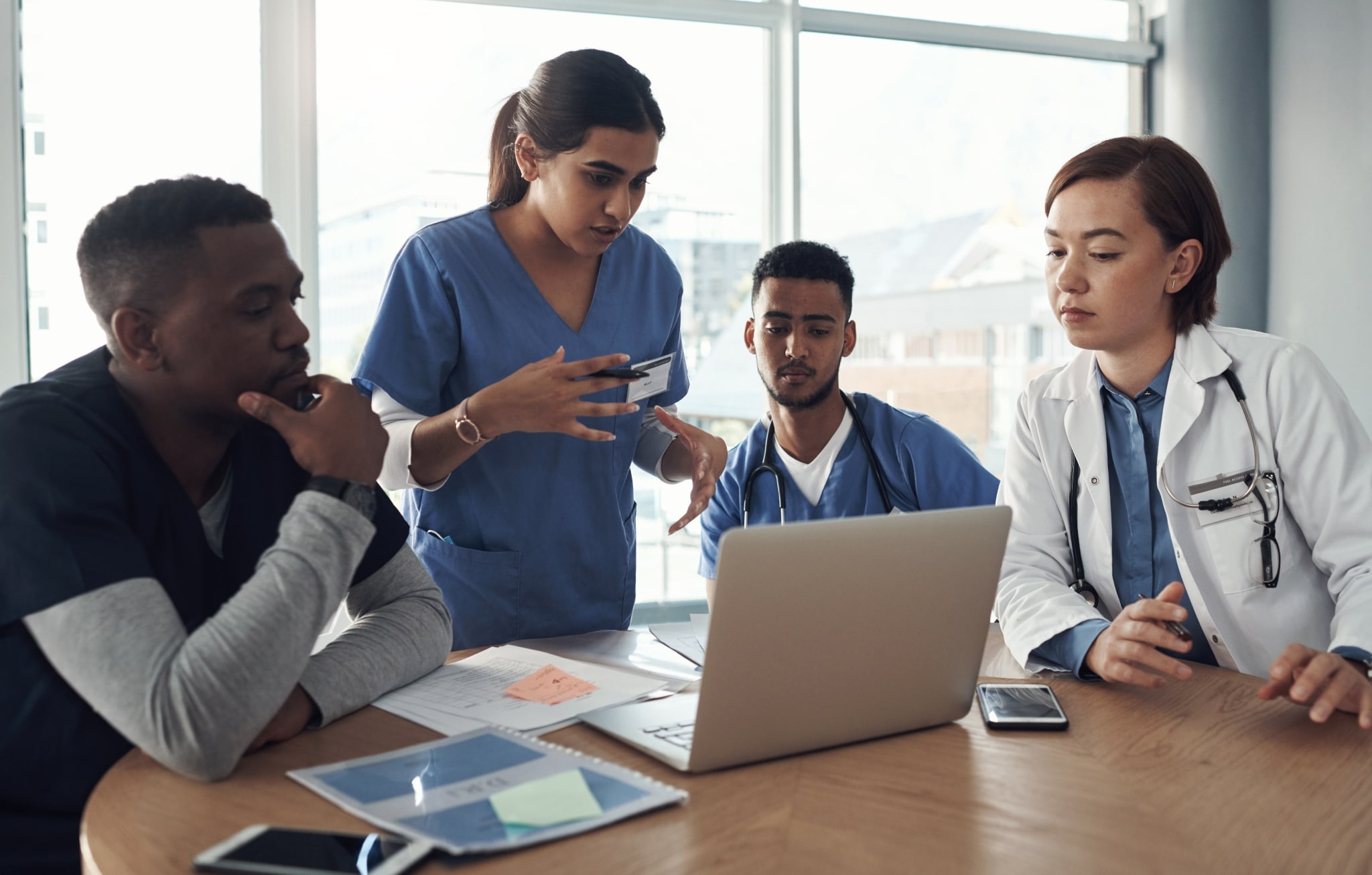 Diverse team of medical professionals at a conference table