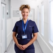 Portrait of a smiling female nurse wearing a uniform