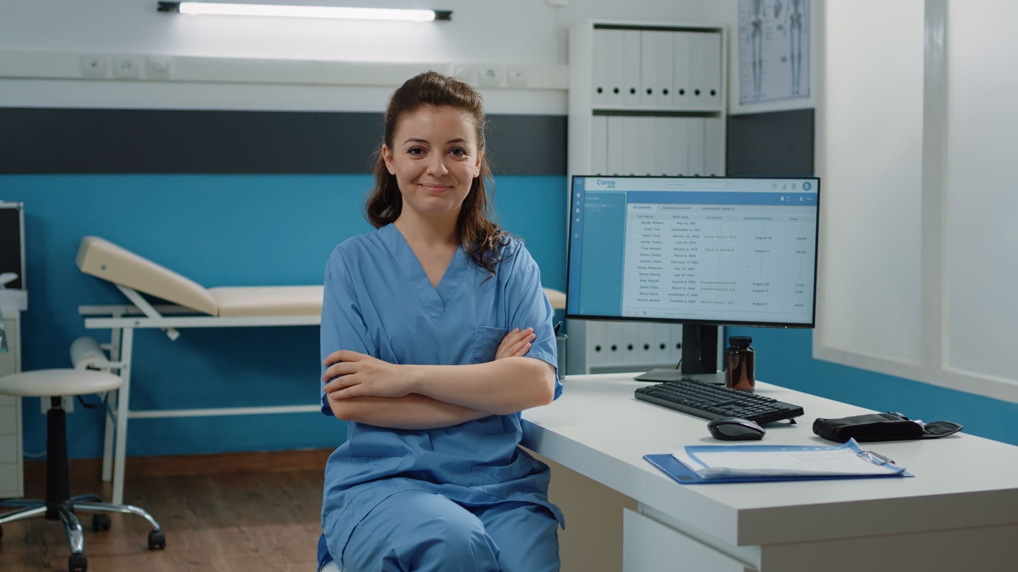 Female medical professional wearing scrubs in a clinic