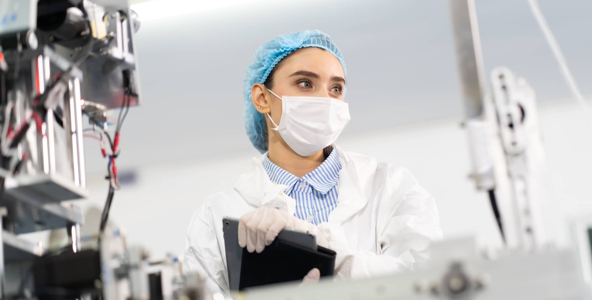 Female Sterile Processing Technician in a mask