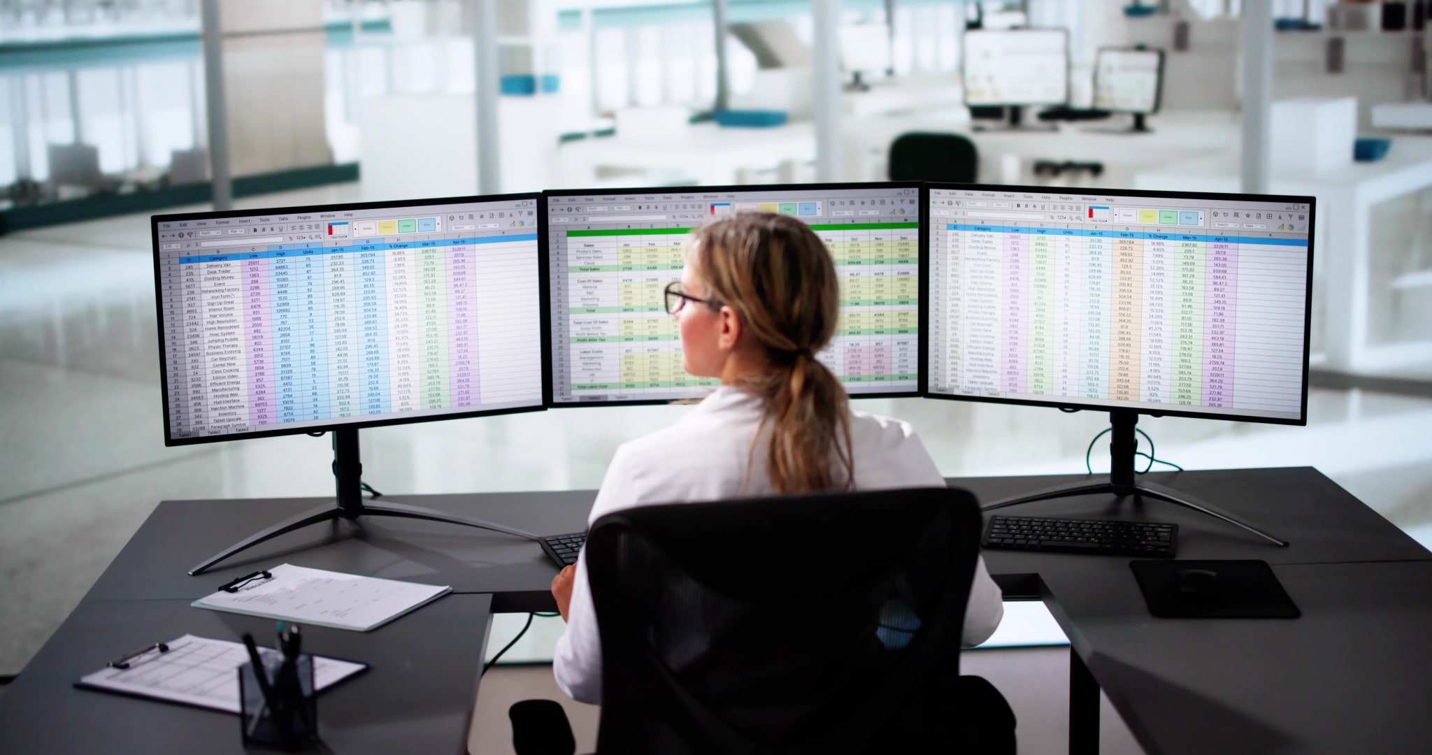 Medical administrative assistant completing billing and coding spreadsheets