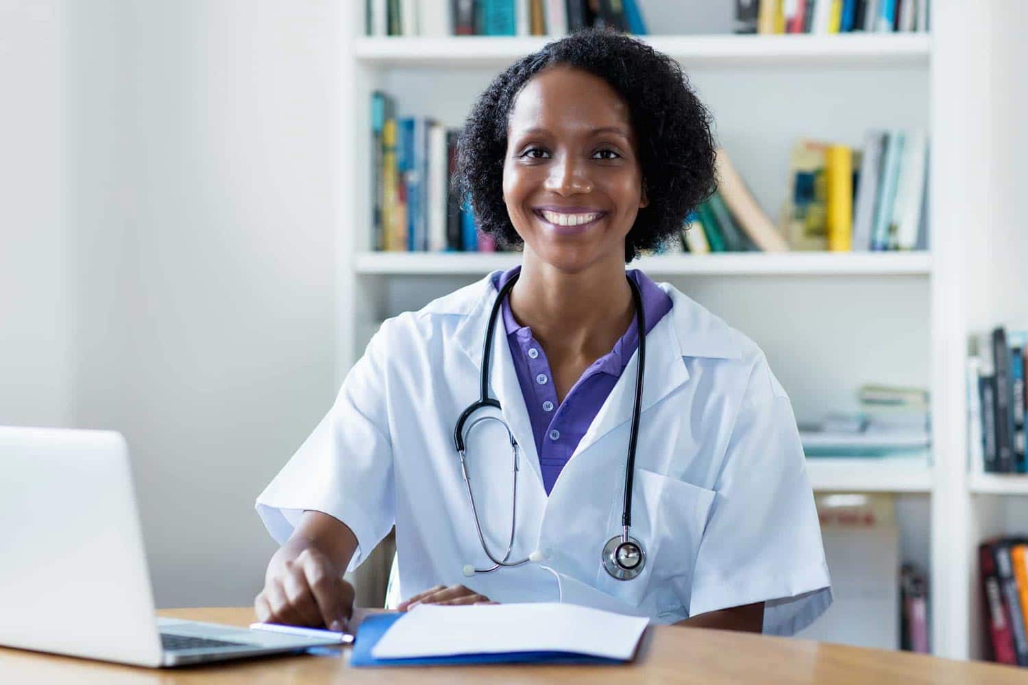 African-American medical professional using a laptop