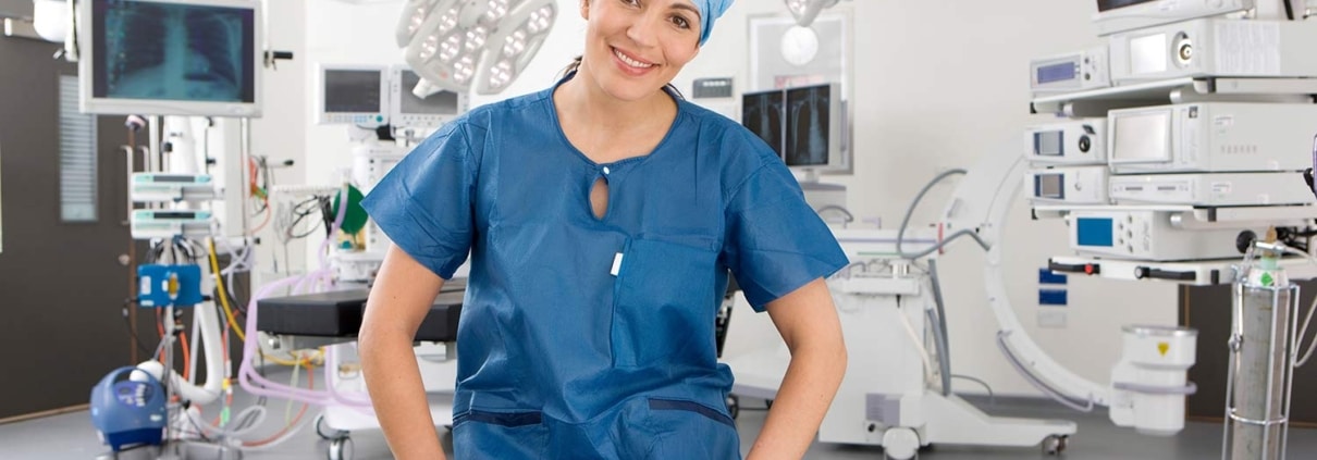 Female medical professional in scrubs sitting in an operating room